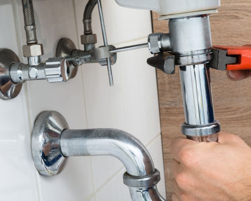36192917 - close-up of male plumber fixing sink in bathroom 36192917 - close-up of male plumber fixing sink in bathroom